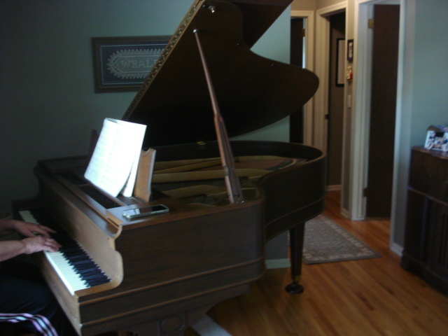 33 - Following tuning and re-assembly, piano owner plays her favorite music